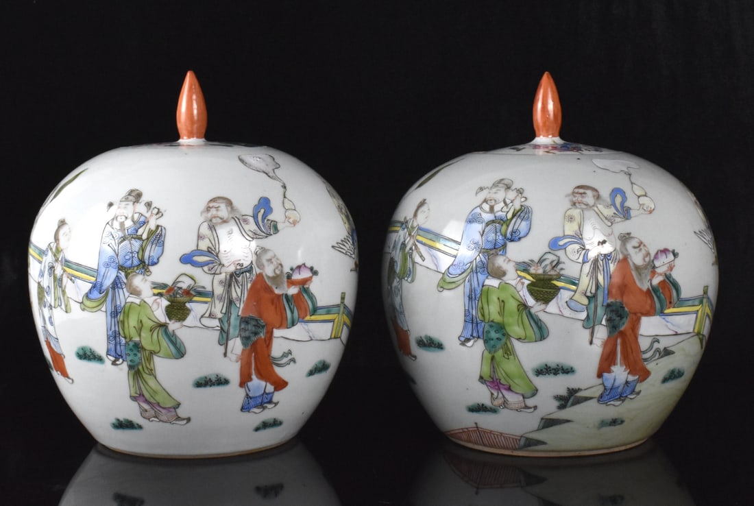 Pair Chinese Famille Rose Covered Jar, 19th C.: A pair of Chinese famille rose covered jars, dating from the 19th century. Each rounded jar decorated with eight deities holding different auspicious objects on hand. Each with recessed cover and oran