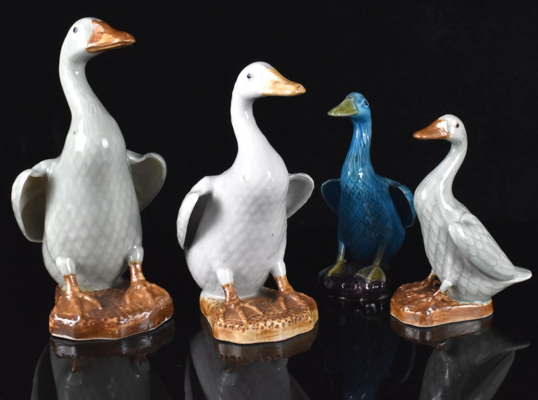 Group of 4 Chinese Porcelain Geese Figure,ROC P.: A group of four Chinese porcelain geese figures, dating from the Republic period. The largest goose is a pale green, the other is a white glaze, and two child geese in celadon and peacock glaze. All a