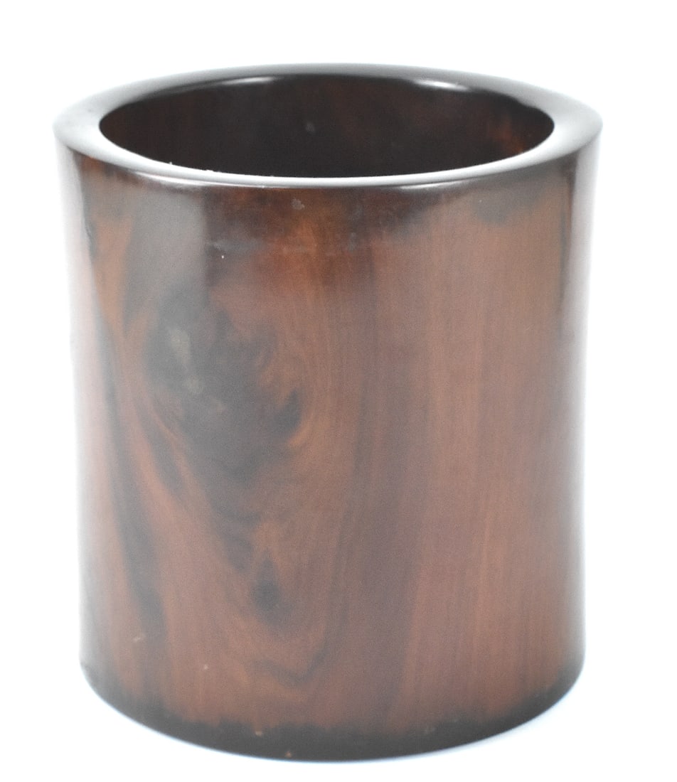 Chinese Huanghuali Carved Brushpot, Qing Dynasty: A Chinese Hunghuali carved brushpot, dating from the Qing dynasty. A smoothly finished Huanghuali cylindrical brushpot with hole in base and rounded rim. Fine grain of Hunghuali wood is showcased on t