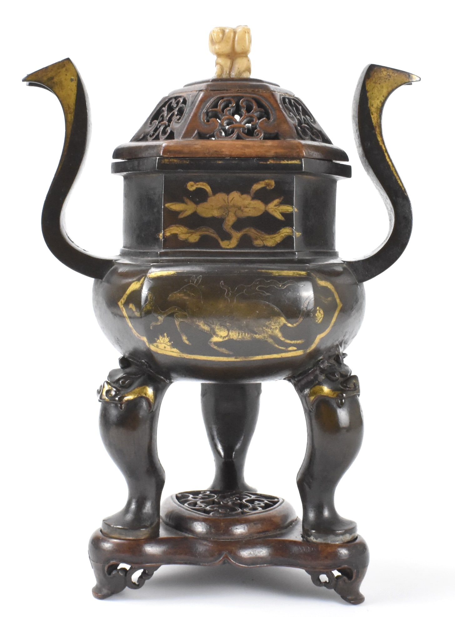 Chinese Gold Inlaid Bronze Censer w/ Cover, Ming D: A Chinese gold inlaid bronze censer with cover, dating from the Ming Dynasty (1368-1644). A striking censer with rounded six sided body and straight six sided upper body. Two large curving archaic sty