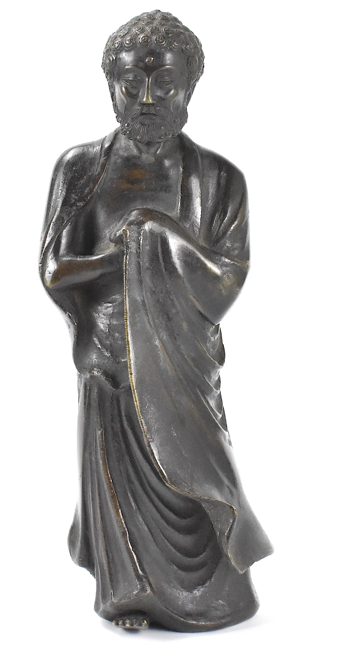 Chinese Bronze Cast Damo Figure, Qing Dynasty: A Chinese bronze case Damo figure, dating from the Qing dynasty. The heavy, solid cast barefoot damo stands with long robes reaching the ground. He clasps his hands together in front under the robe an