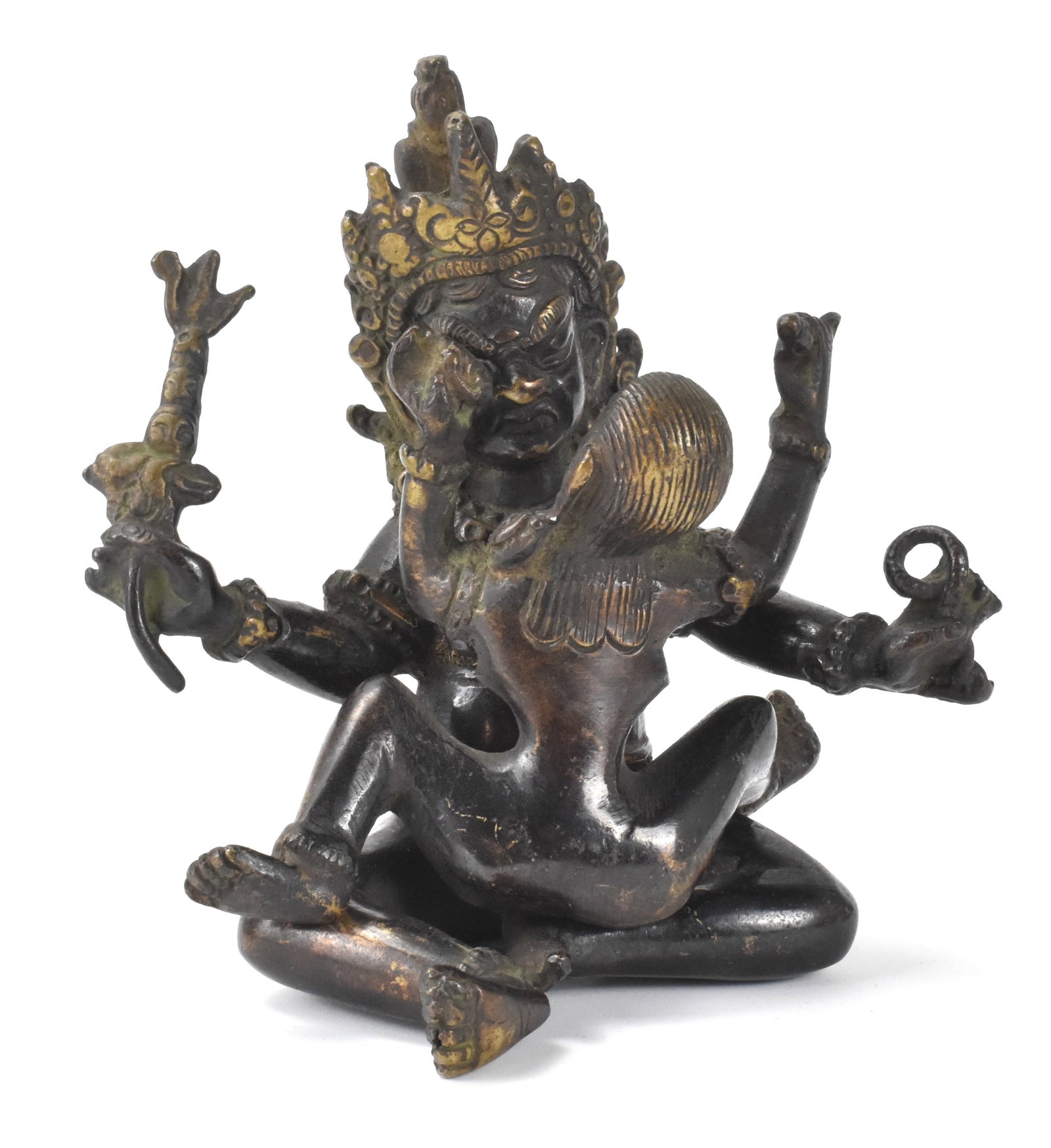 Chinese Gilt Bronze Yab Yum Buddha Figure, 17th C.: Chinese gilt bronze Yab Yum Buddha figure, dated from 17th C, fierce figure seated in yab yum with his consort over prostrated figures, his both arms holding Buddhist attributes H: 4 7/8"(12.5 cm) Col
