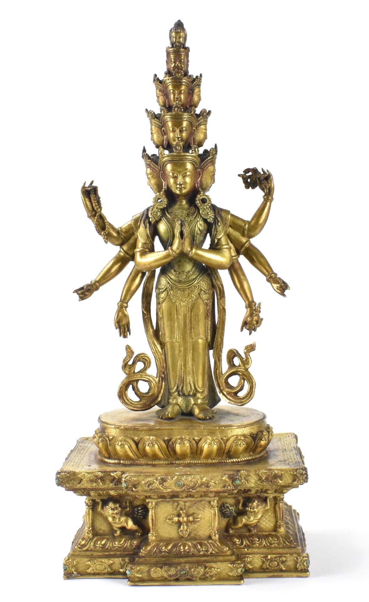 Tall Chinese Gilt Bronze Buddha Guanyin Figure: A tall Chinese Gilt bronze Buddha figure. The standing barefoot figure has eight arms, two are in front with palms together, the six others holding auspicious items or in a mudra position. Eleven head