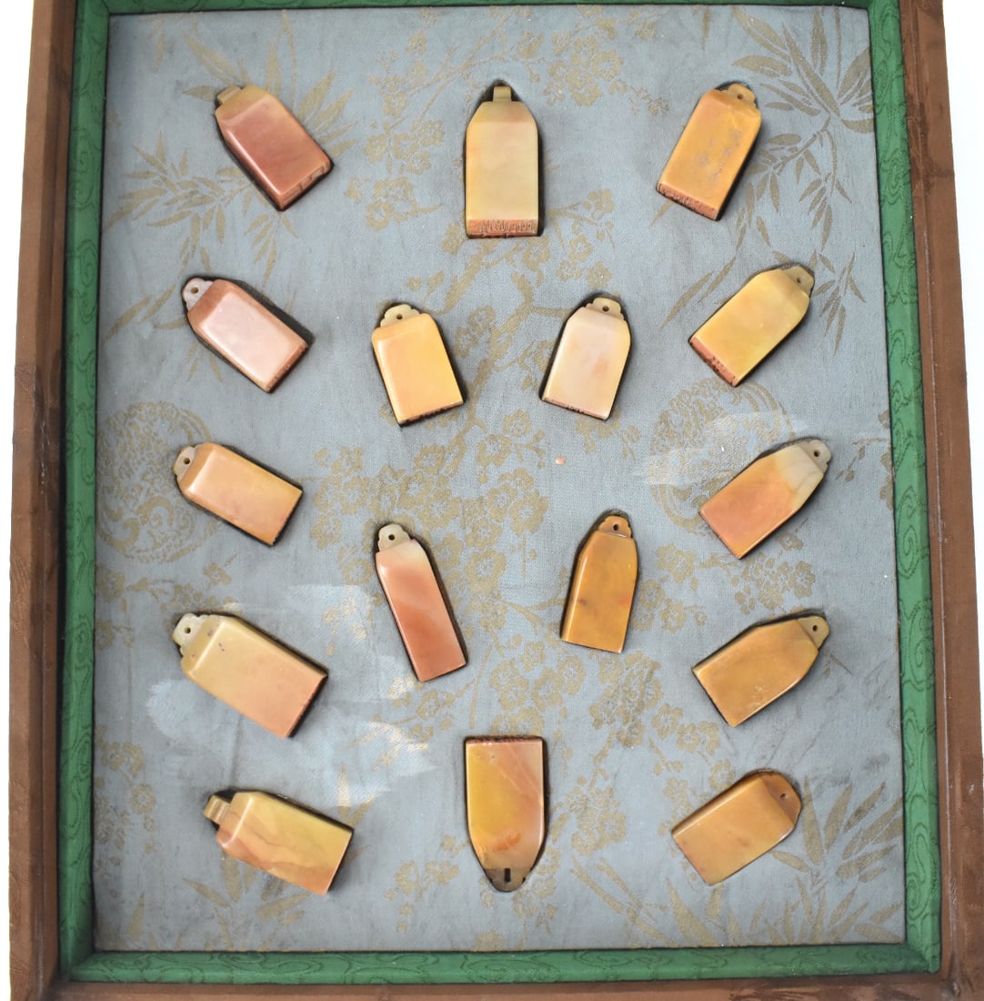 Group of 16 Chinese Soapstone Carved Seal Stamps: A group of 16 Chinese soapstone carved seals stamps in box. Each rectangular seal is vertical orientation and tapers to a small top with tiny hole for hanging. smooth on the sides and tiny archaic top