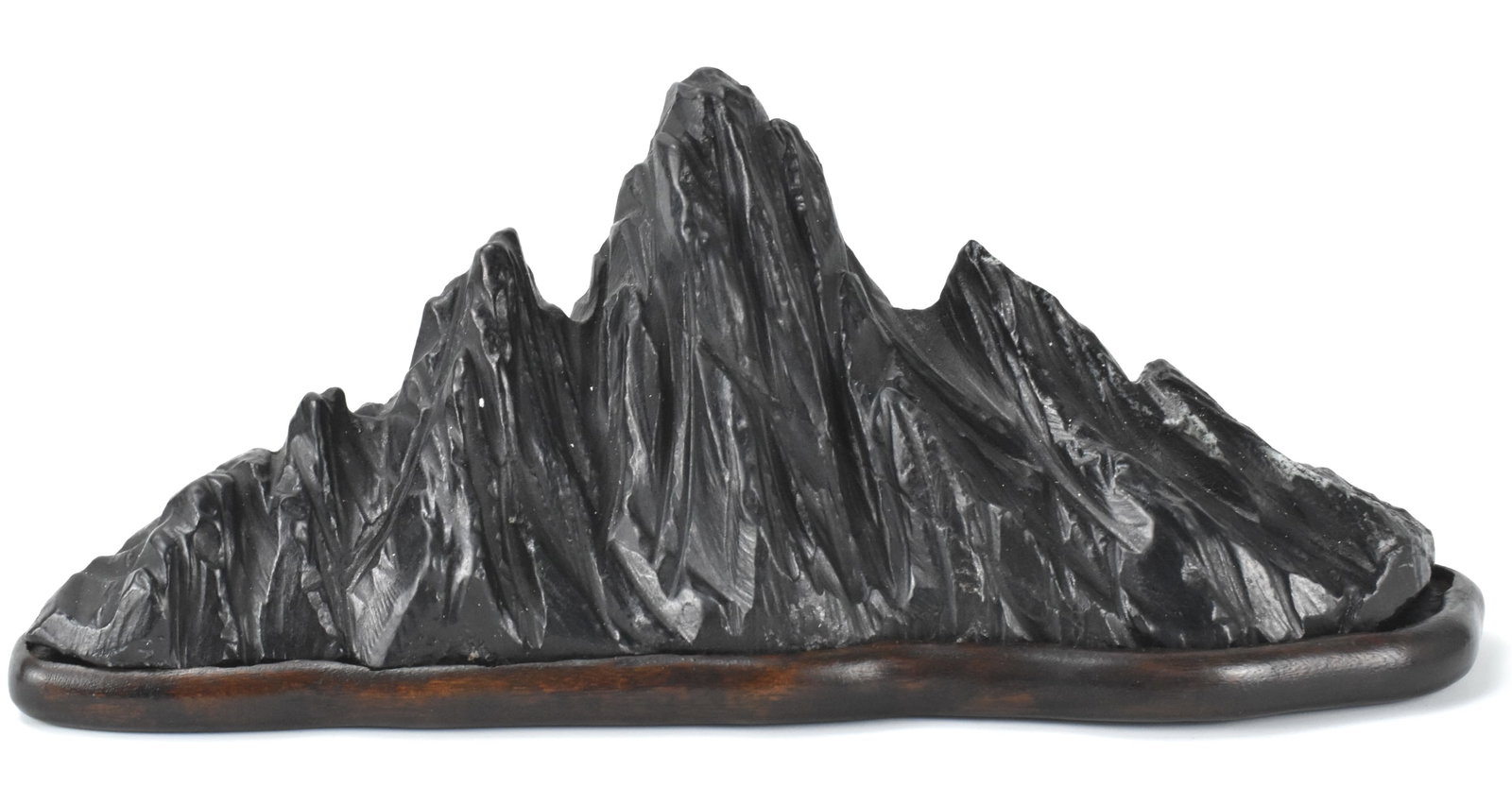 Chinese Lingbi Stone Carved Brush Holder on Stand: A Chinese lingbi stone carved brush holder on wooden stand. The stone carving resembles that of a black craggy mountain range, with different heights of rock jutting out. Accompanied by a low custom s