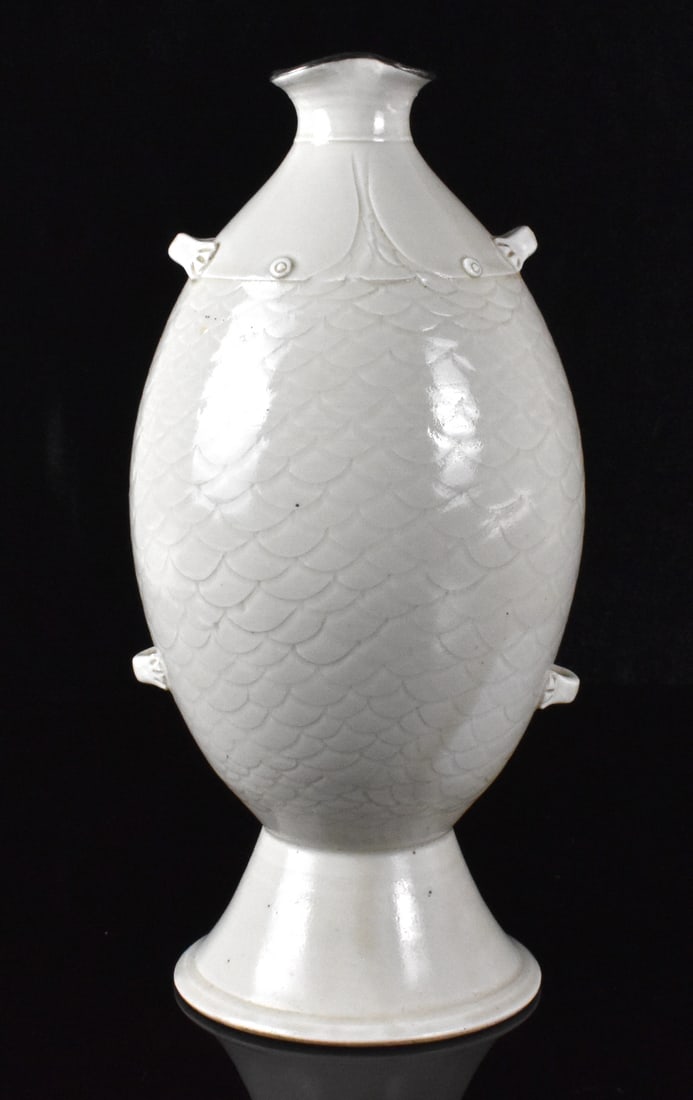Chinese Ding Style White Glazed Twin Fish Vase: A Chinese Ding style twin fish vase. in the style of two auspicious fish design, scales impressed into the pottery. two pair of loop handles on both sides, mounted mouth rim with metal H. 9 1/4 (23.5 