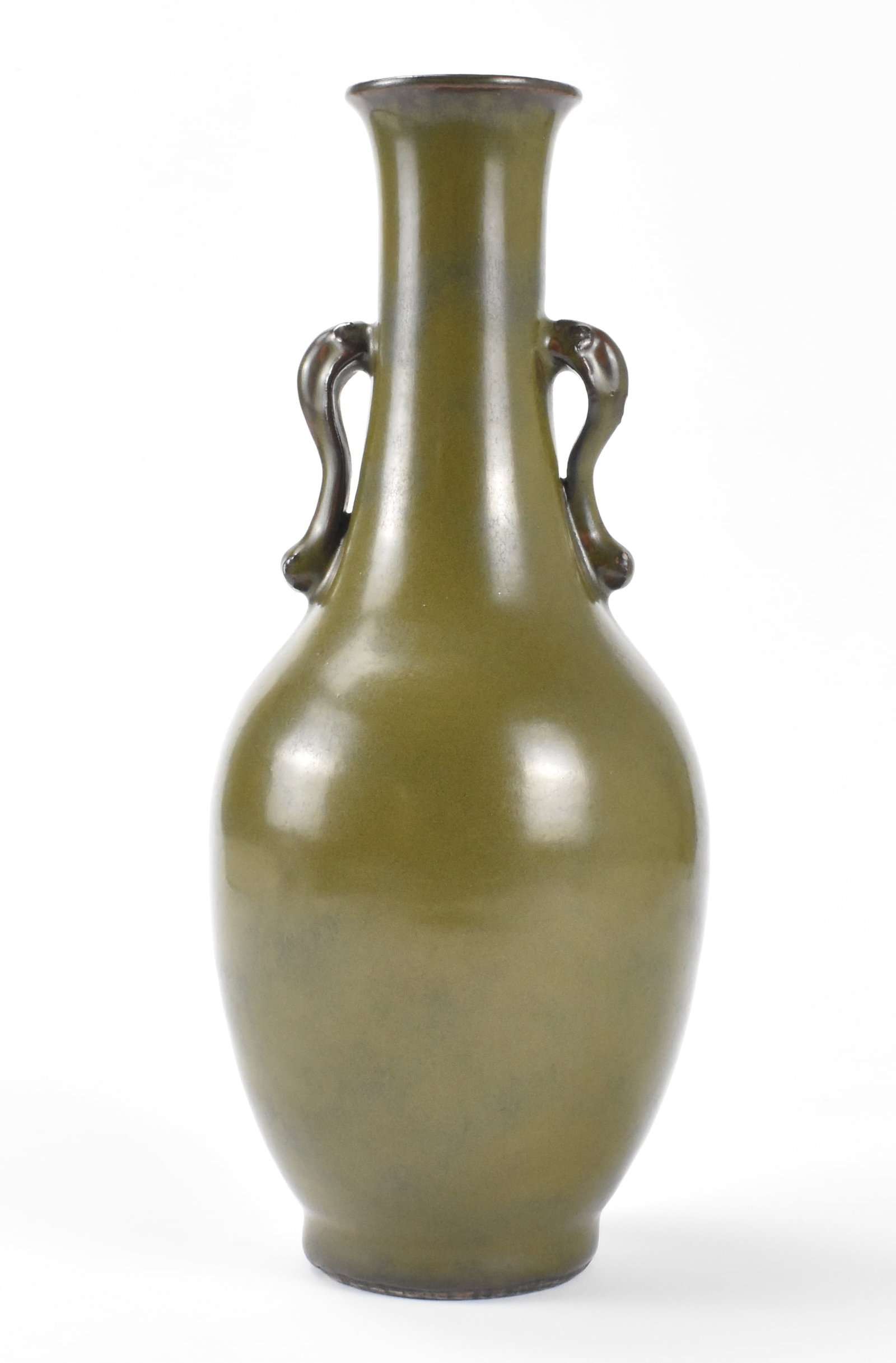 Chinese Teadust Glazed Vase w/ Handles, 19th C.: A Chinese teadust glazed vase with elephant trunk handles.dated from 19th C. Oval body tapering to curved long neck and flared mouth with rounded rim. Curving animal handles on each side of the neck. 