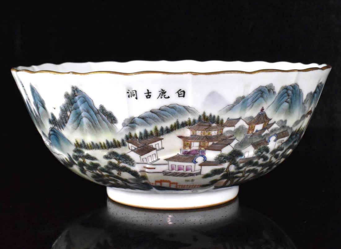 Chinese Famille Rose Landscape Bowl: A Chinese famille rose landscape bowl. A deep bowl, with straight foot. With decorative tulip style around the deep interior sides. exterior a vivid and colorful Chinese landscape incorporating trees,