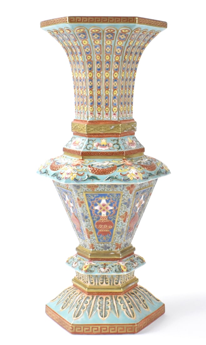 Chinese Rococo Style Yangcai Hexagonal Vase: A Chinese Rococo style Yangcai enamled hexagonal vase. Very heavily potted vase with different sizes of hexagonal levels, leading to a wide flared mouth with sharp rim. Design elements include raised 