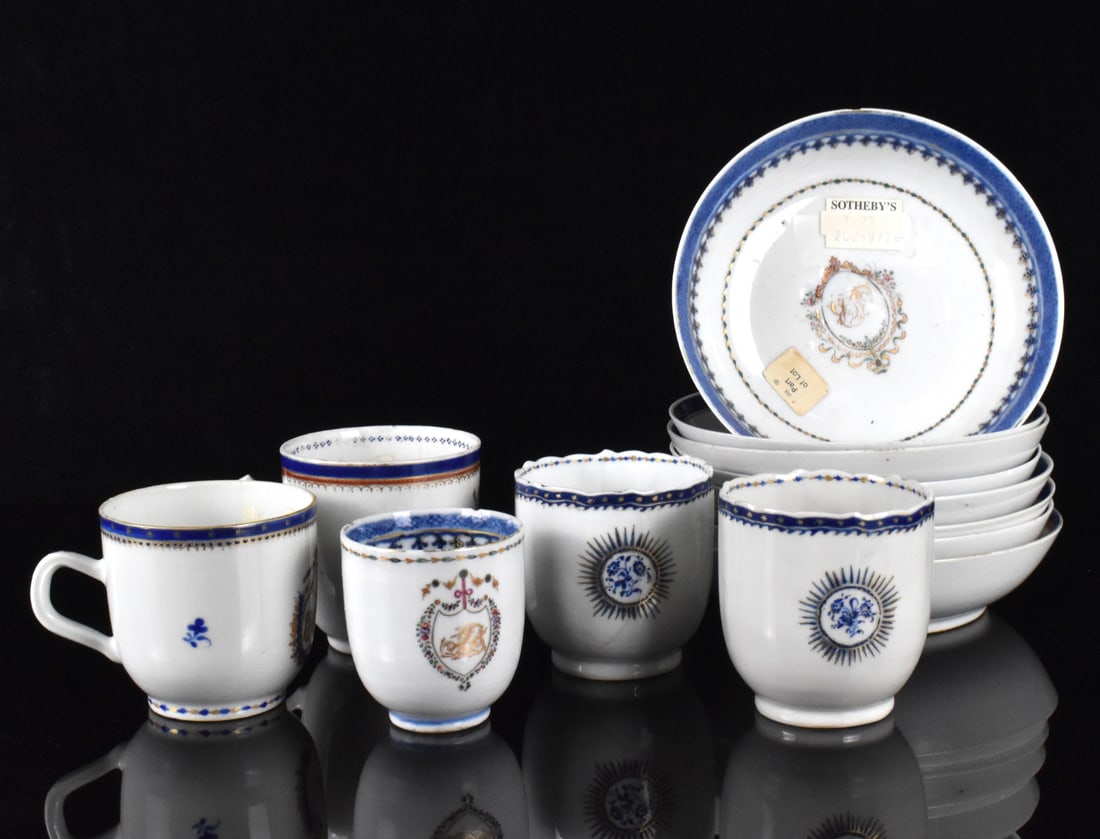 Set of 12 Chinese Export Armorial Dish &Cup,18th C: A set of 12 Chinese export armorial dishes and cups, dating from the 18th century. seven dishes with blue rings around rim and armorial marks. With a Sothebys sticker. Cups also have blue band around 