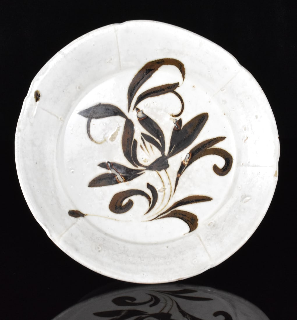 Chinese Cizhou Ware Black Floral Lobed Dish,Song D: A Chinese Cizhou ware black floral lobed dish, dating from the Song dynasty (960-1279). Ancient stoneware dish adorned with floral design in brown glaze over milky white ground. Sides divided into six