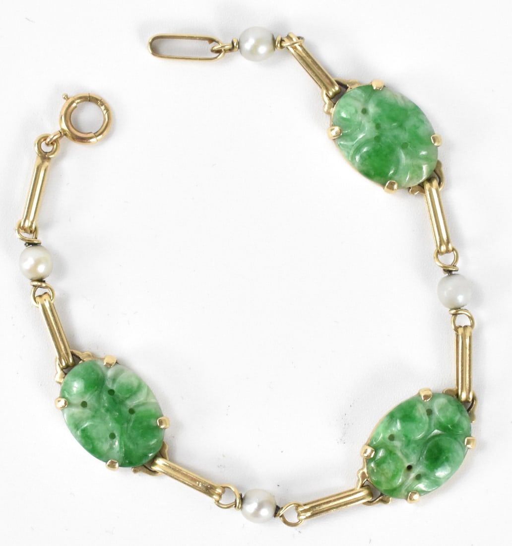 14k Chinese Gold & Jadeite Bracelet, Qing Dynasty: A 14k Chinese gold and jadeite bracelet. Comprised of three oval, rounded jadeite pieces connected to links of gold, with four tiny round pearl shape stones threaded into the bracelet, and a clasp. To