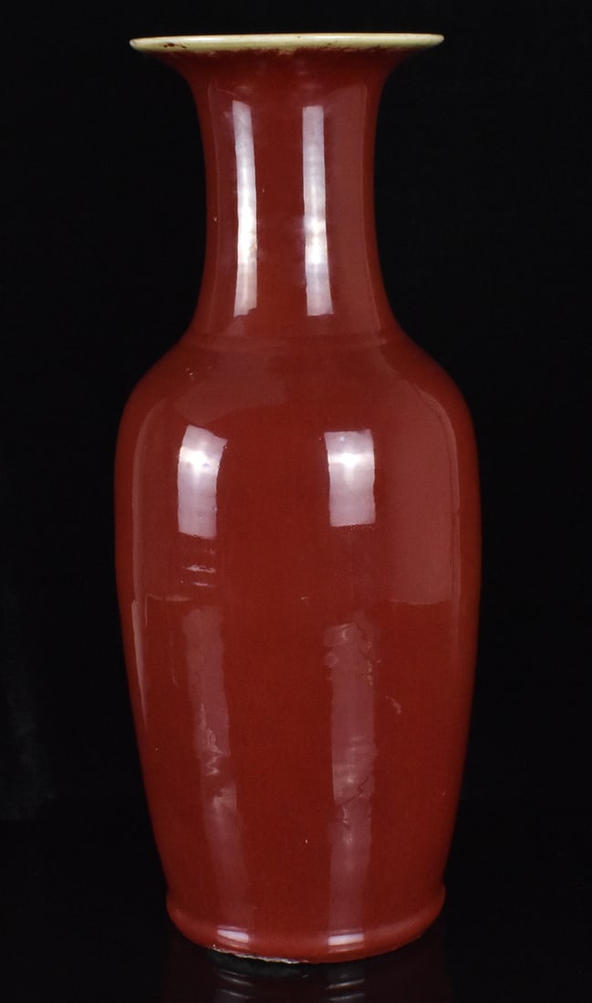 Large Chinese Oxblood Glazed Vase, 18th C.: A largr Chinese oxblood vase, dating from the 18th century. Heavily potted stoneware vase with wide base and straight lower body, tapering to a wide neck then flaring to a wider mouth. Interior and ex