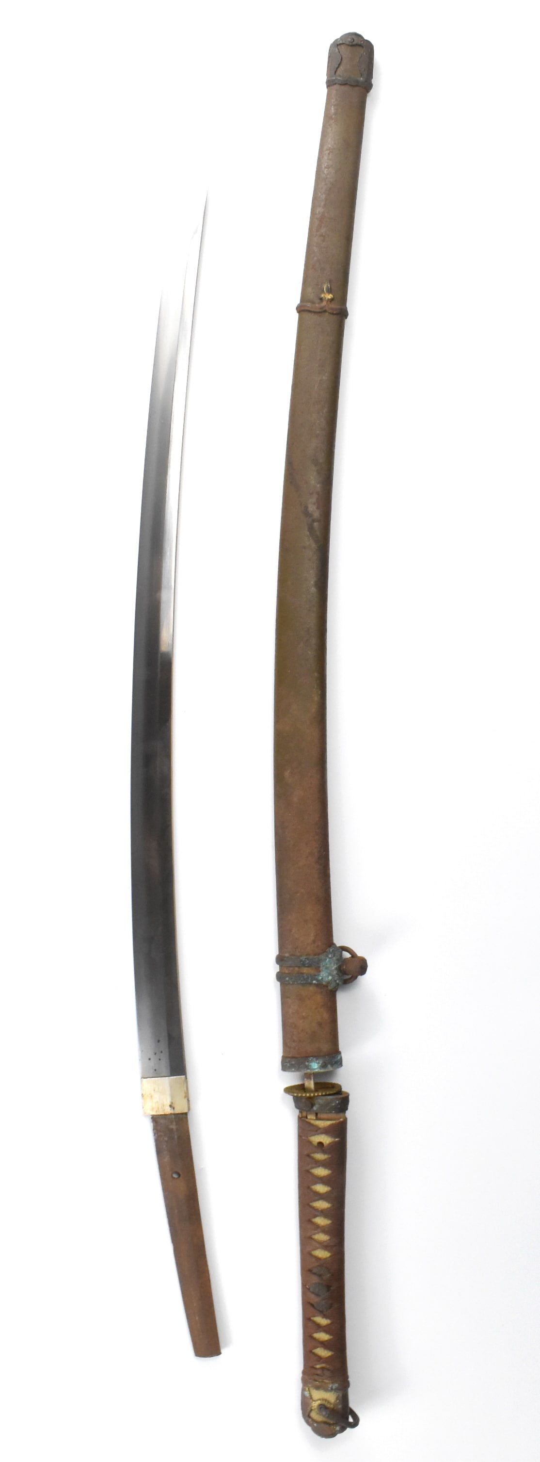 Mumei,Japanese WWII Military Katana Sword ,Showa P: Mumei, Japanese WWII military sword dating from the Showa period (1926-1989), long curved blade with curved edge tip, gilt tsuba and long tightly wrapped cord rayskin handle,metal scabbard with fittin