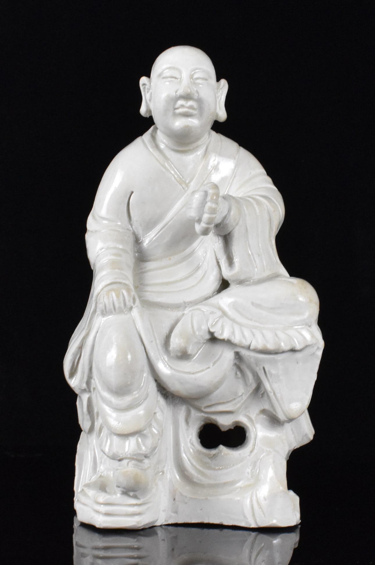 Chinese White Glazed Seated Luohan Figure, 19th C.