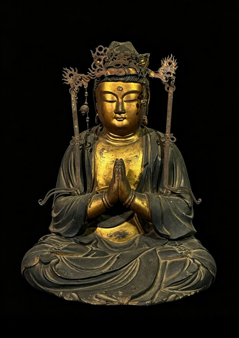 Japanese Gild Wood Buddha, Edo Period: A Japanese edo period (1603-1868) wooden Buddha figure with gold lacquer. The Buddah is seated with legs crossed and has hands together in front palm to palm. covered with gold lacquer. H. 11" (27.9 c