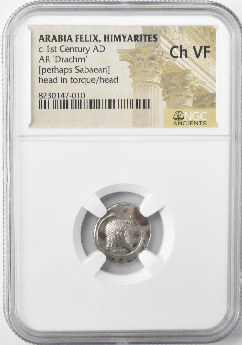 Silver Ancient Coin Arabia Felix Himyarites1st C.: A silver ancient coin Arabia Felix (from the southwestern corner of the Arabian Peninsula (modern day Yemen). Himyarites 1st Century AD Drachm (perhaps Sabaean). Head in torzue/head. NGC Grade: Ch VF 