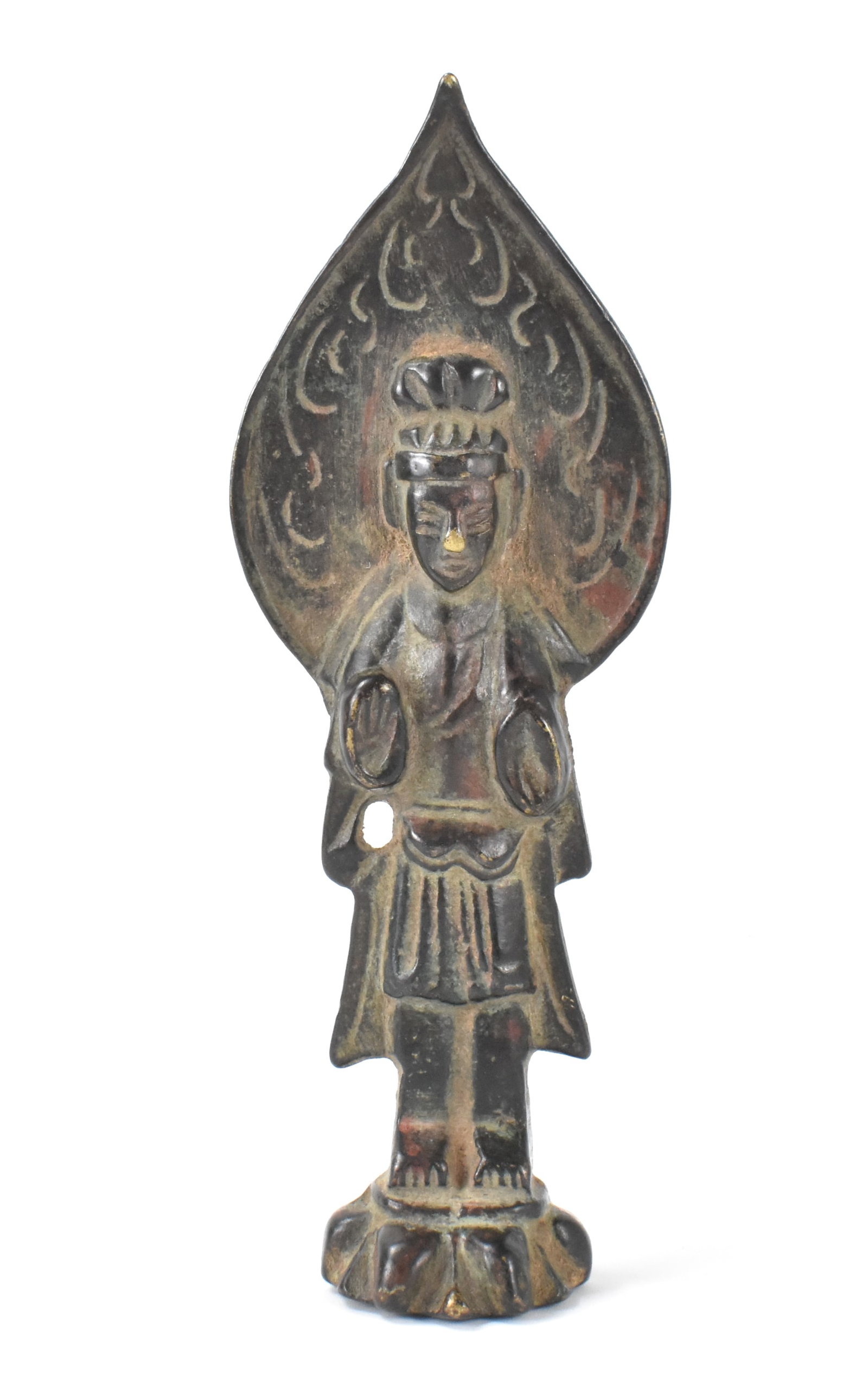 Chinese Bronze Cast Standing Buddha, Ming Dynasty: A Chinese bronze case standing Buddha figure, dating from the Ming dynasty (1368-1644). The small Buddha is standing on a narrow lotus platform in his robes with both hands facing palm outwards in mud