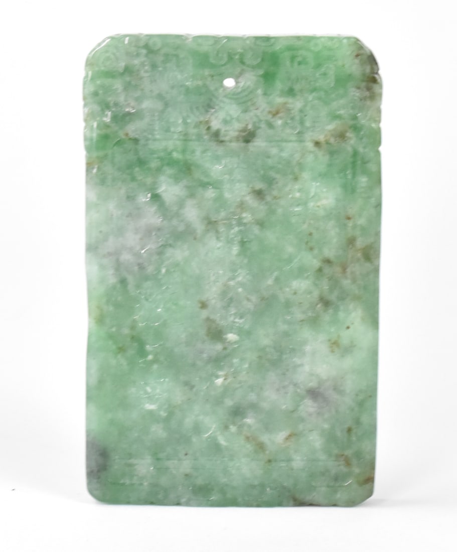 Chinese Jadeite Carved Plaque: A Chinese jadeite carved plaque. A two sided rectangular plaque with an incised figure riding an elephant on one side and Chinese characters on opposite. Rounded corners and small hole at top for thre