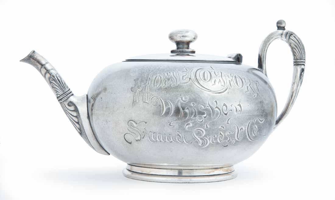 UNUSUAL WHISKEY ADVERTISING TEAPOT: Pairpoint, New Bedford, MA, silver plate. Queen Anne-style teapot with period-engraved advertisement "HOME COMFORT Whiskey Samuel Bros. & Co." 4" high.