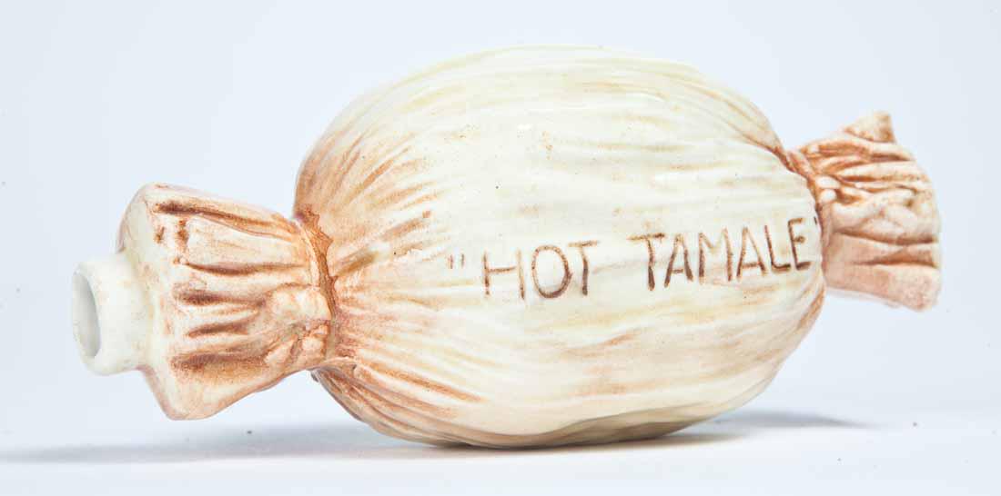 FIGURAL "HOT TAMALE" FLASK: Probably German, late 19th-early 20th century. In the form of a wrapped tamale with the spout at one end. 6" long.