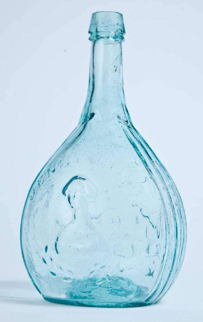 JENNY LIND CALABASH FLASK: GI-107, Fislerville Glass Works, Fislerville, NJ, mid-19th century, quart, aqua in color, with Lind's portrait on the obverse and the glass house on the reverse, and with a pontil mark. 9" high.