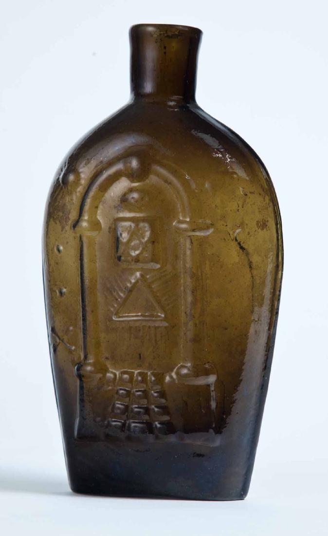KEENE EAGLE & MASONIC FLASK: GIV-17, Keene-Marlboro-Street Glass Works, Keene, NH, mid-19th century, pint, olive-amber in color, with Masonic decoration on the obverse and an eagle over "KEENE" on the reverse, plain lip, and pont