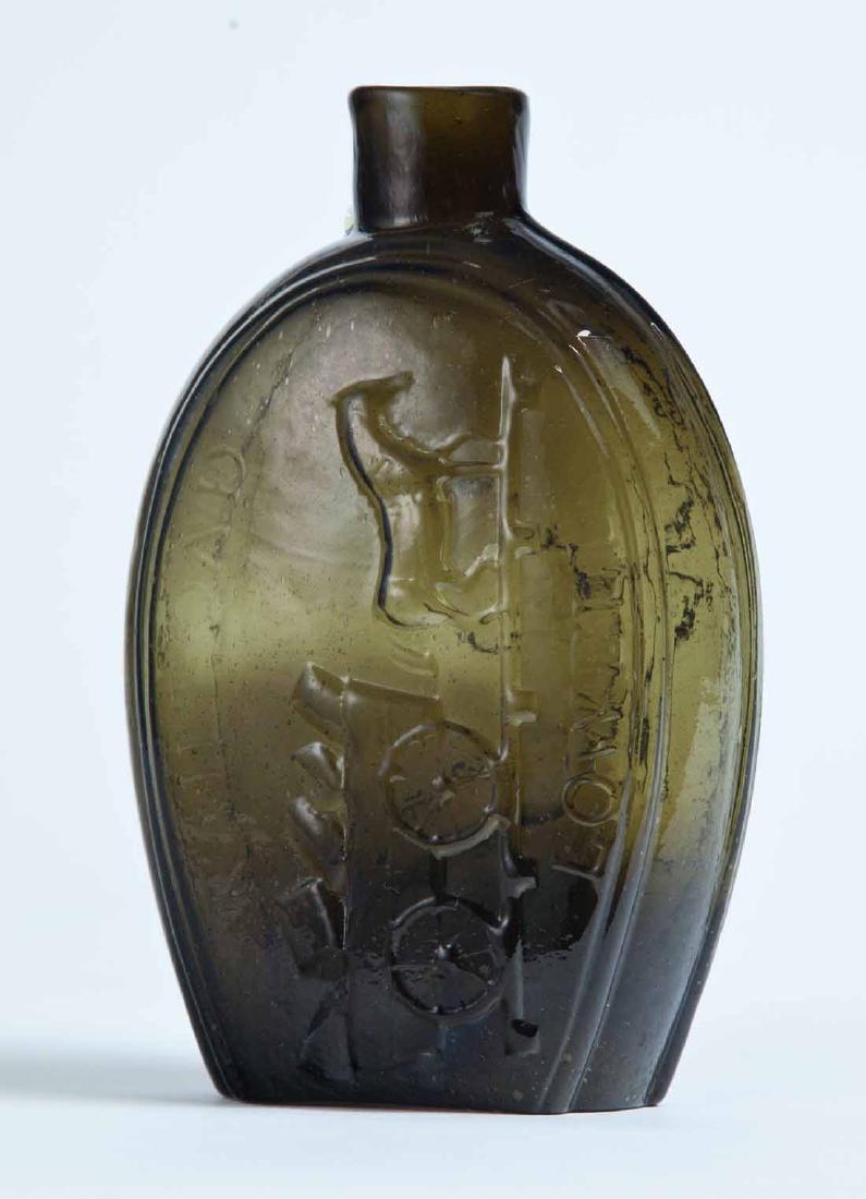 RAILROAD & EAGLE "LOWELL" FLASK: GV-10, Coventry, CT, mid-19th century, half pint, olive-green in color, with a train and "RAILROAD" and "LOWELL" on the obverse and an eagle and 13 stars on the reverse, plain lip, and pontil mark. 5.