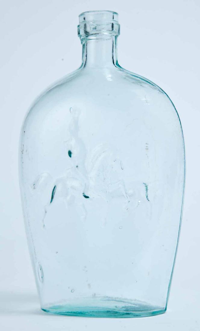 DRAGOON & HOUND FLASK: GXIII-16, Baltimore Glass Works, mid-19th century, quart, aqua in color, with a sabre-wielding dragoon on the obverse and a large hound on the reverse, ringed lip, and plain base. 8.5" high.