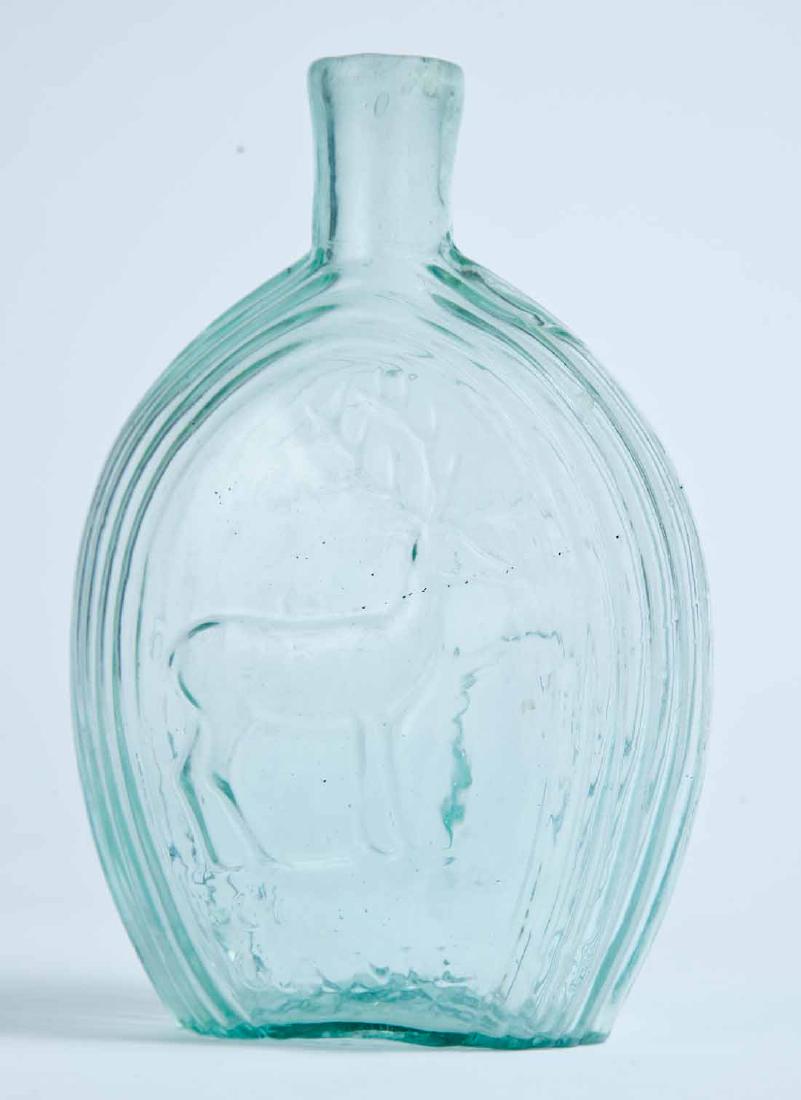 "GOOD GAME" & WILLOW FLASK: GX-1, Coffin and Hay, Hammonton, NJ, mid-19th century, pint, aqua in color, with a stag and "GOOD GAME" on the obverse and a willow on the reverse, and a plain lip and pontil mark. 6.875" high.