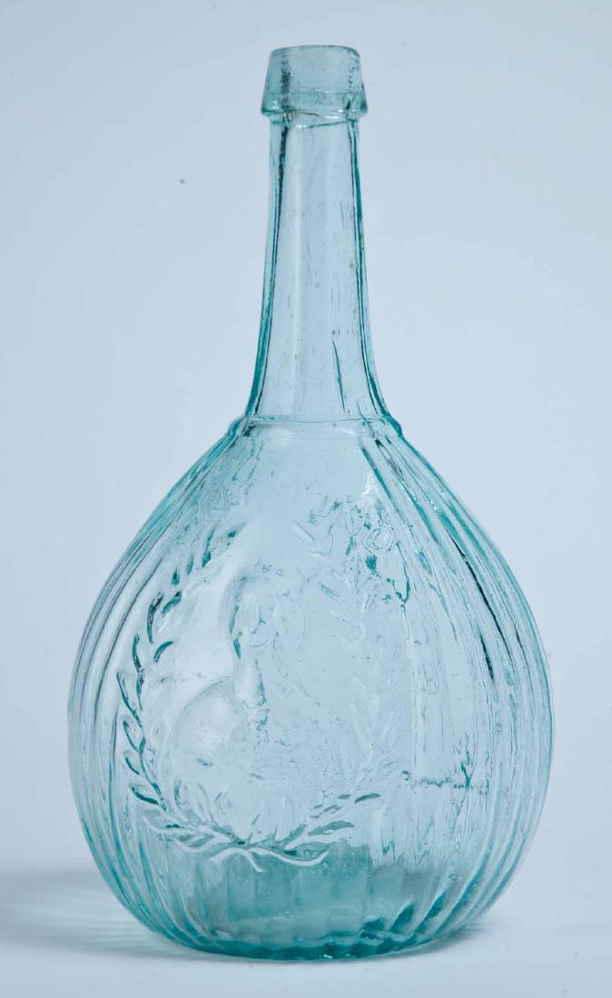 JENNY LIND CALABASH FLASK: GI-103, Whitney, Glassboro, NJ, mid-19th century, quart, aqua in color, with "JENY LIND" and portrait on the obverse and the glass factory on the reverse, and with a tapered lip and pontil mark. 10.25