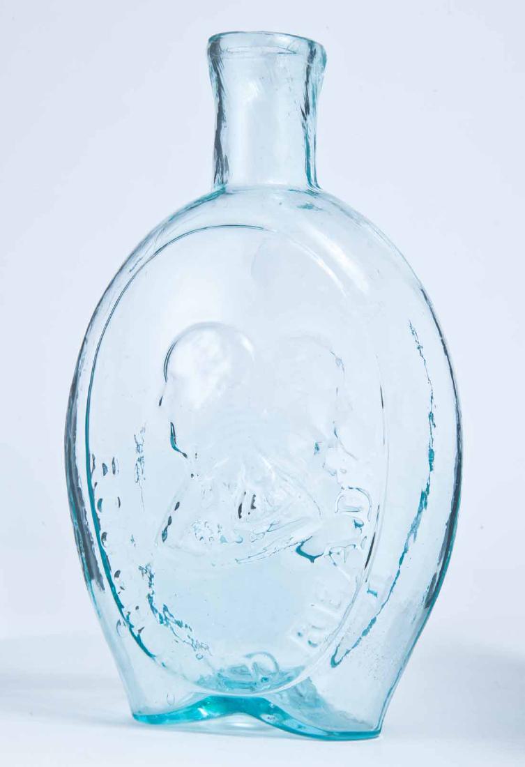 TAYLOR & RINGGOLD FLASK: GI-72, Baltimore Glass Works, mid-19th century, pint, aqua in color, with Taylor and "ROUGH AND READY" on the obverse and "MAJOR RINGGOLD" and portrait on the reverse, plain lip and rough pontil. 7" h