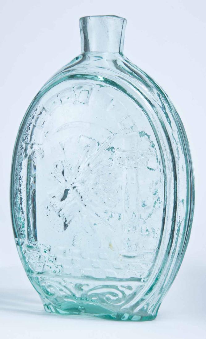 MASONIC & EAGLE FLASK: GIV-37, Kensington Glass Works, Philadelphia, mid-19th century, pint, aqua in color, with Masonic arch and Farmer's Arms on the obverse and an eagle over "T.W.D." on the reverse, plain lip and pontil 