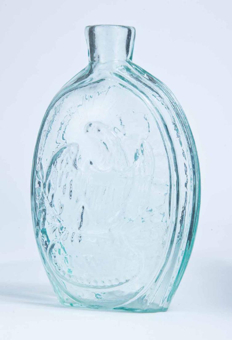 EAGLE & SHIP FRANKLIN FLASK: GII-42, Kensington Glass Works, Philadelphia, mid-19th century, pint, aqua in color, with an eagle and "T.W.D." on the obverse and a ship and "FRANKLIN" on the reverse, and a plain lip and pontil mark