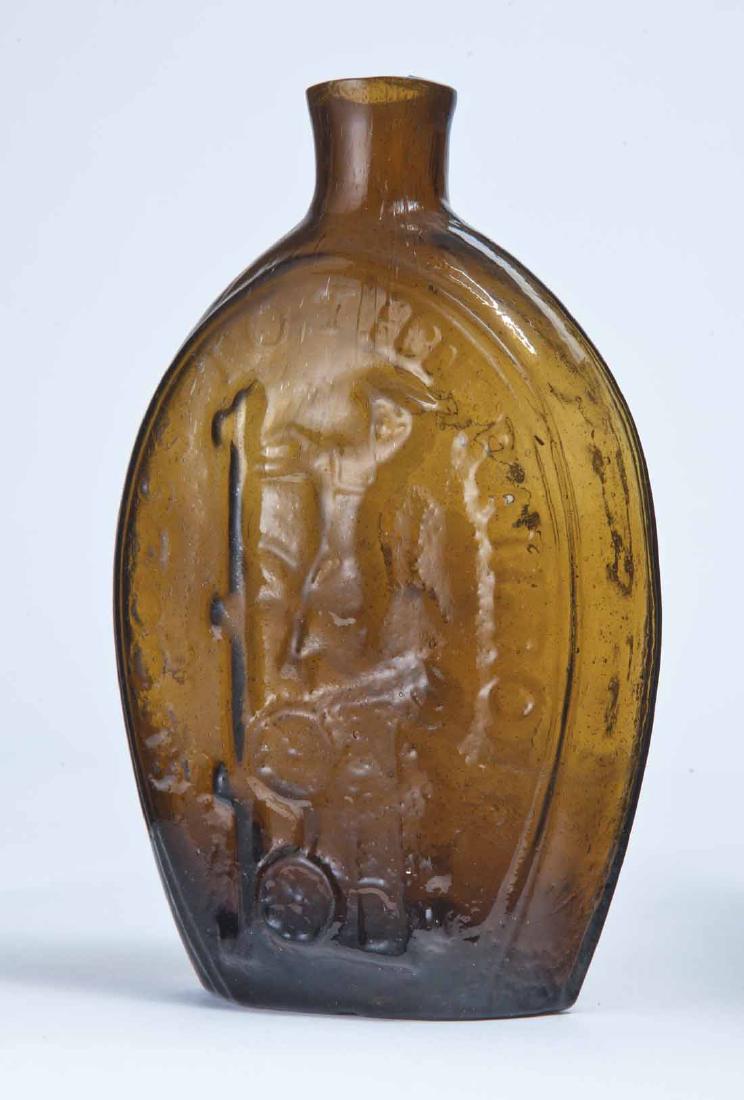 "SUCCESS TO THE RAILROAD" & EAGLE FLASK: GV-8, Coventry, CT, mid-19th century, pint, amber in color, with "SUCCESS TO THE RAILROAD" and horse-drawn cart on the obverse and an eagle and stars on the reverse, plain lip an pontil mark. 6.75" hi