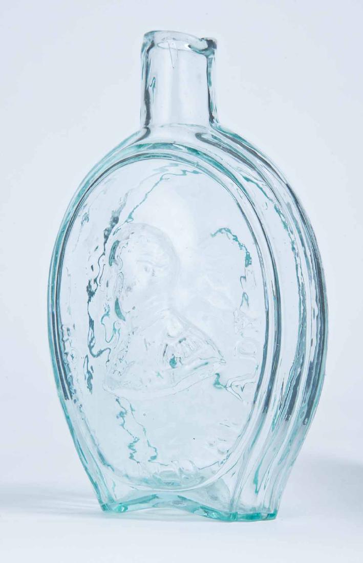 TAYLOR & RINGGOLD FLASK: GI-71, Baltimore Glass Works, mid-19th century, pint, aqua in color, with Taylor and "ROUGH AND READY" on the obverse and "MAJOR RINGGOLD" and portrait on the reverse, plain lip and rough pontil. 6.75