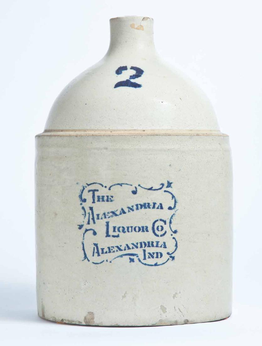 ALEXANDRIA, INDIANA ADVERTISING STONEWARE LIQUOR JUG: 2-gallon jug with stenciled capacity mark and advertisement "THE ALEXANDRIA LIQUOR CO ALEXANDRIA IND." 13.25" high.