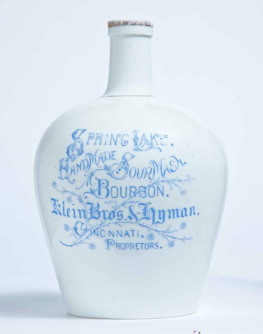 CINCINNATI, OHIO ADVERTISING PORCELAIN LIQUOR JUG: Knowles, Taylor, and Knowles, East Liverpool, small size, with stamped advertisement "SPRING LAKE HANDMADE SOUR MASH BOURBON. Klein Bros. & Hyman. CINCINNATI, PROPRIETORS." 7.5" high.