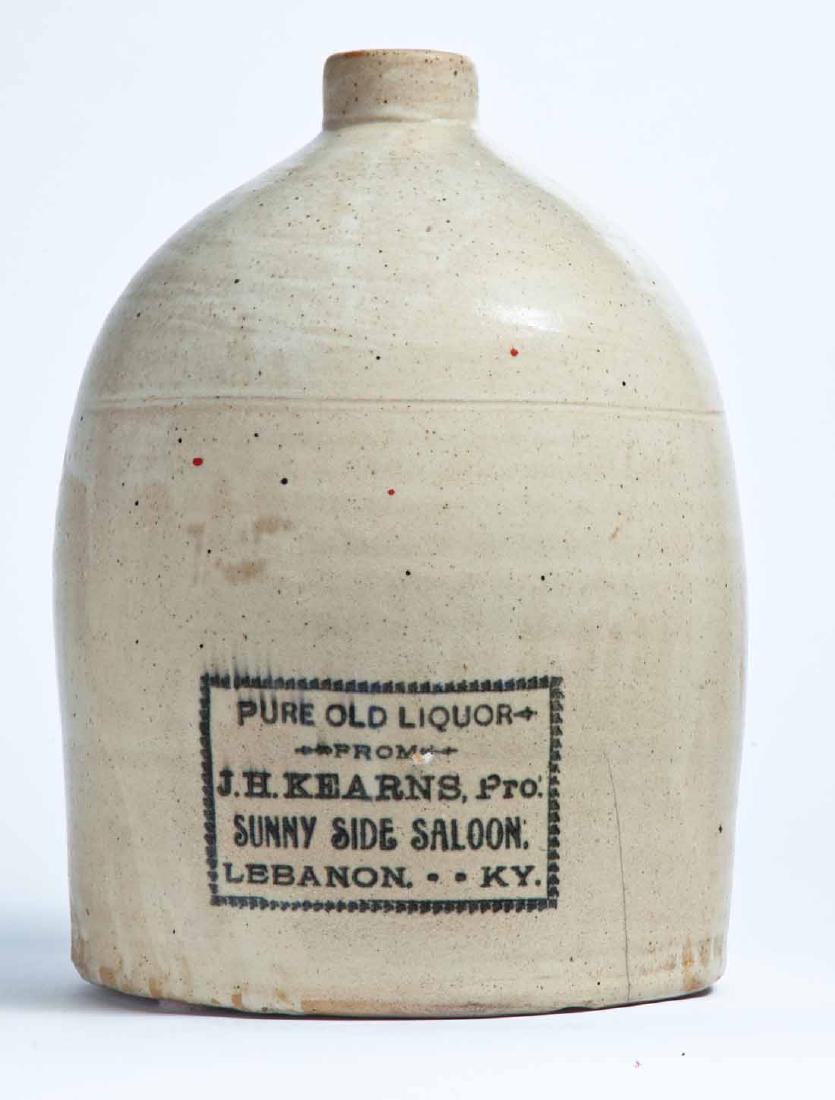 LEBANON, KENTUCKY ADVERTISING STONEWARE LIQUOR JUG: 2-gallon jug with stamped advertisement "PURE OLD LIQUOR FROM J.H. KEARNS, Pro. SUNNY SIDE SALOON, LEBANON, KY." 12.5" high.
