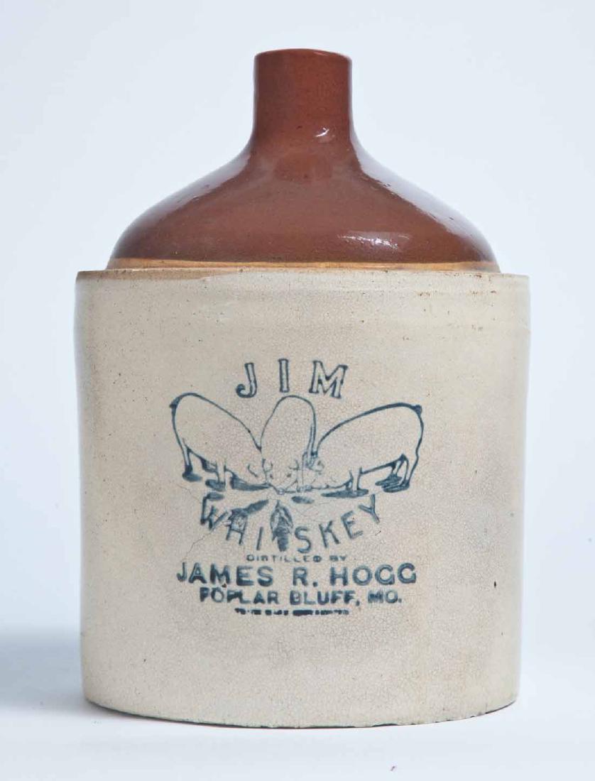 POPLAR BLUFF, MISSOURI ADVERTISING STONEWARE WHISKEY: 1-gallon jug with bicolor glaze and stamped advertisement "JIM WHISKEY DISTILLED BY JAMES R. HOGG POPLAR BLUFF, MO." 10.25" high.