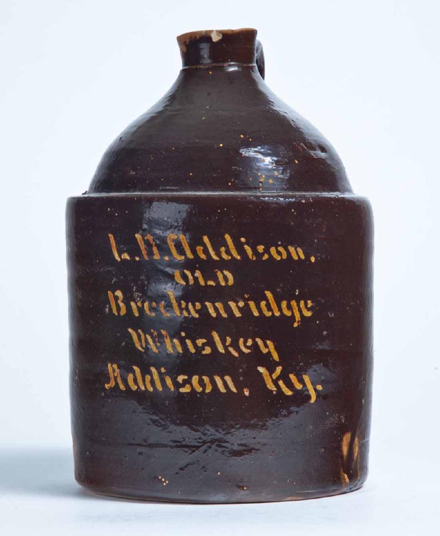 ADDISON, KENTUCKY ADVERTISING STONEWARE WHISKEY JUG: 1-gallon jug with brown glaze and scratch-decorated advertisement "L.D. Addison OLD Breckenridge Whiskey Addison, Ky." 9" high.