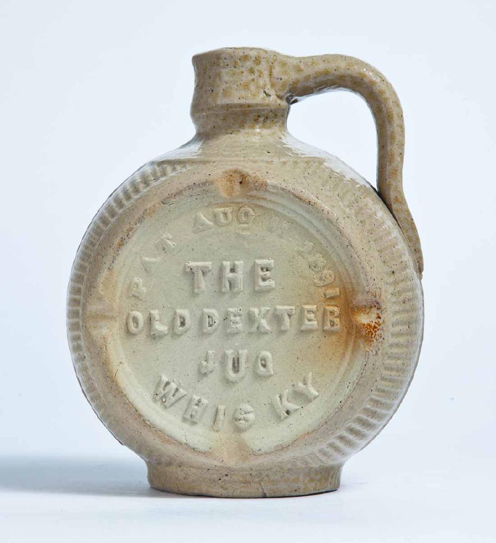 BUTLER, KENTUCKY ADVERTISING MOLDED STONEWARE JUG: Small size, double-sided molded advertisement "THE OLD DEXTER JUG WHIS KY PAT. AUG. 11, 1891" and "OLD DEXTER DISTILLING CO. DISTILLERS BUTLER, KENTUCKY." 7.25" high.