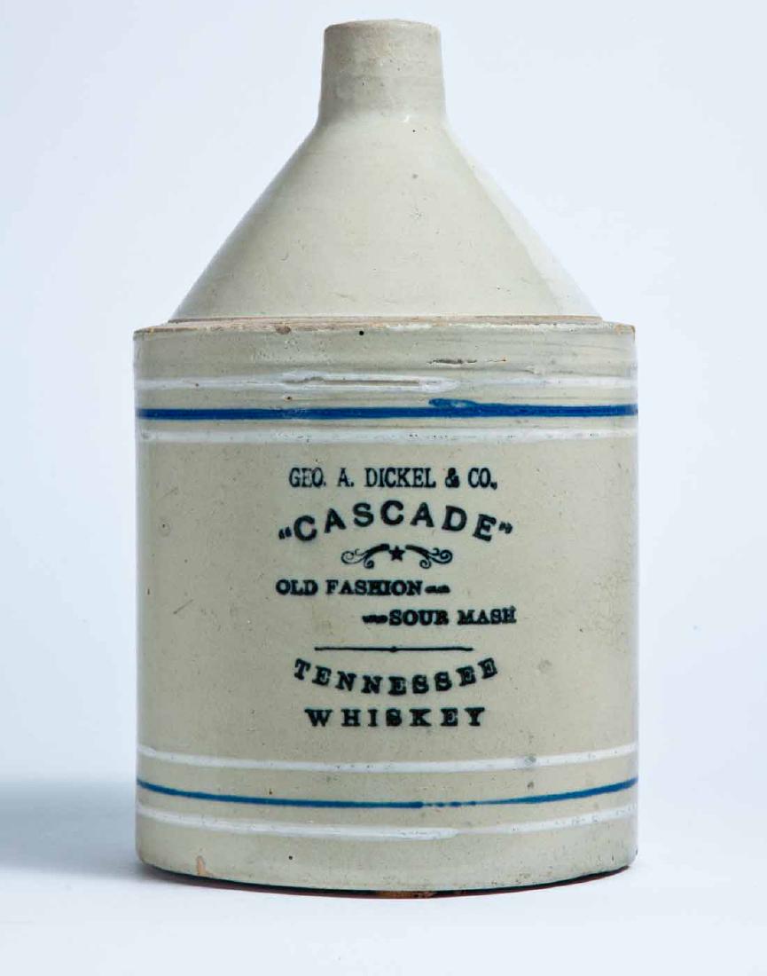 TENNESSEE ADVERTISING STONEWARE WHISKEY JUG: 1-gallon jug with cobalt and white striping and stamped advertisement "GEO. A. DICKEL & CO. "CASCADE" OLD FASHION SOUR MASH TENNESSEE WHISKEY." 11.5" high.