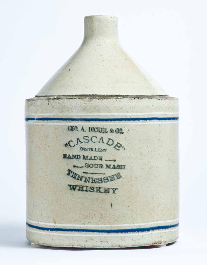 TENNESSEE ADVERTISING STONEWARE WHISKEY JUG: 2-gallon jug with cobalt and white striping and stamped advertisement "GEO. A. DICKEL & CO. "CASCADE" DISTILLERY HAND MADE SOUR MASH TENNESSEE WHISKEY." 13" high.