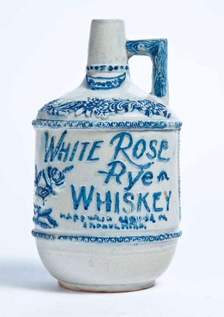 ST. PAUL, MINNESOTA ADVERTISING MOLDED STONEWARE: White's, Utica, small jug with molded and cobalt-highlighted decoration and advertisement "WHITE ROSE Rye WHISKEY F.J. BOWLIN LIQUOR CO. ST. PAUL, MINN." 8" high.