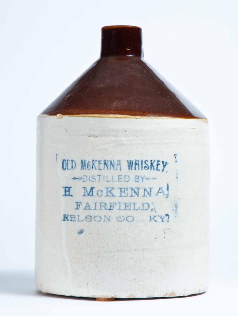 FAIRFIELD, KENTUCKY ADVERTISING STONEWARE WHISKEY JUG: 1-gallon jug with bicolor glaze and stamped advertisement "OLD MCKENNA WHISKEY DISTILLED BY H. MCKENNA FAIRFIELD, NELSON CO., KY." 10.5" high.