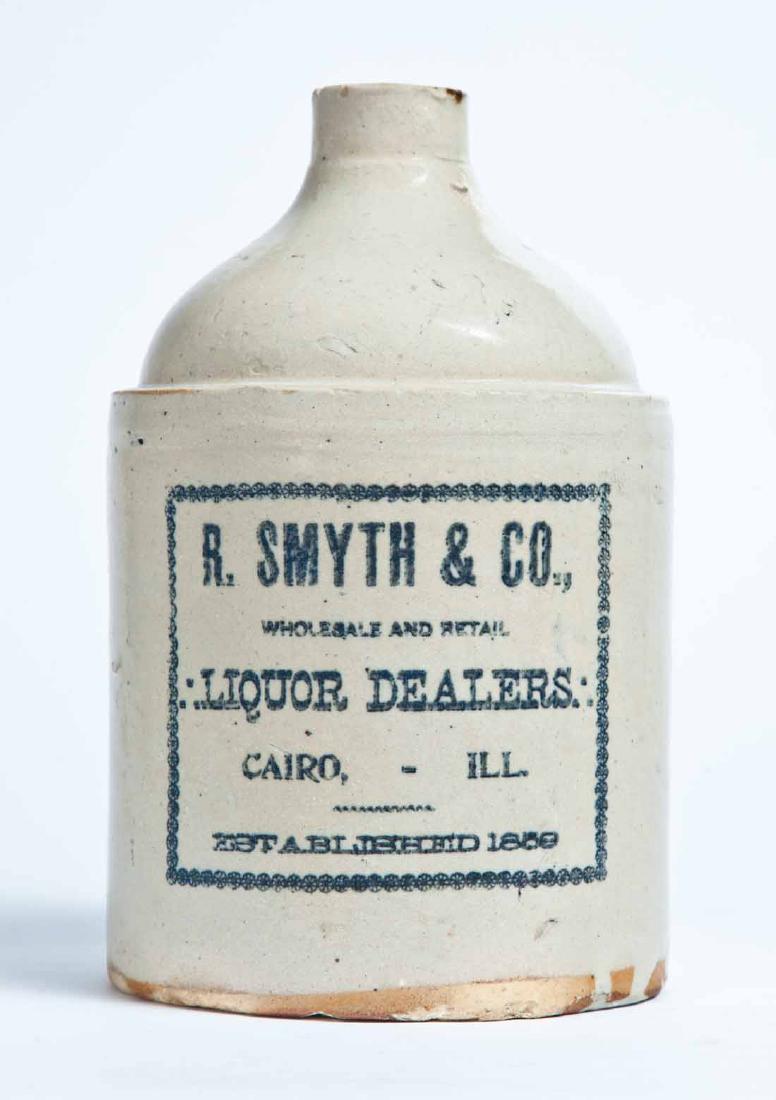 CAIRO, ILLINOIS ADVERTISING STONEWARE LIQUOR JUG: Half-gallon jug with stamped advertisement "R. SMYTH & CO., WHOLESALE AND RETAIL LIQUOR DEALERS. CAIRO, ILL. ESTABLISHED 1859." 9" high.