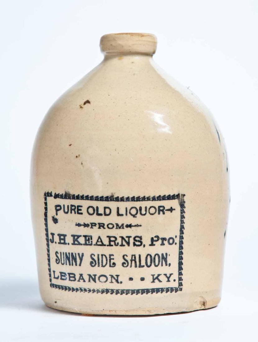 LEBANON, KENTUCKY ADVERTISING STONEWARE LIQUOR JUG: Half-gallon jug with stamped advertisement "PURE OLD LIQUOR FROM J.H. KEARNS, Pro. SUNNY SIDE SALOON, LEBANON, KY." 9" high.