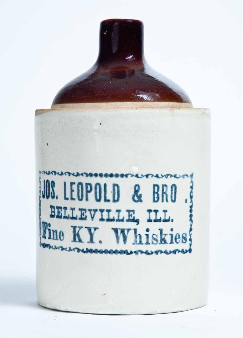 BELLEVILLE, ILLINOIS ADVERTISING STONEWARE WHISKEY JUG: Half-gallon jug with bicolor glaze and stamped advertisement "JOS. LEOPOLD & BRO. BELLEVILLE, ILL. Fine KY. Whiskies." 9" high.