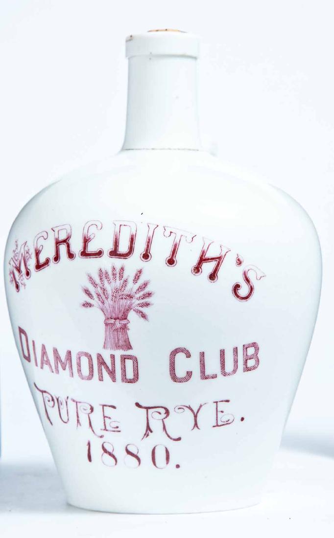 EAST LIVERPOOL, OHIO ADVERTISING PORCELAIN WHISKEY JUG: Knowles, Taylor, and Knowles, East Liverpool, small jug with stamped advertisement "MEREDITH'S DIAMOND CLUB PURE RYE WHISKEY. 1880." Appears to retain its original printed cork. 7.75" high.